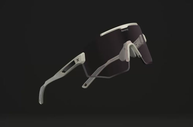 3D showcase of Revoray Lumo Gold sports sunglasses with photochromic lens changing color and reflectivity