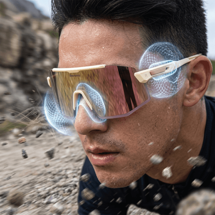 A gravel cyclist navigating rough terrain, with a visualization showing the shock-absorbing functionality of Revoray's air cushion nose pads, dampening vibration.